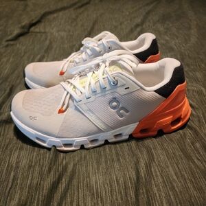 On Running White and Coral Athletic Shoes